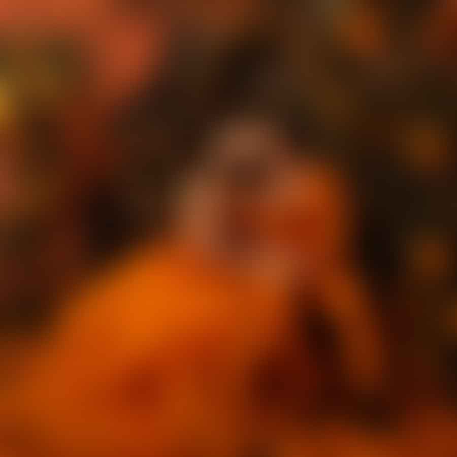 Couple enjoying a romantic moment surrounded by orange elements